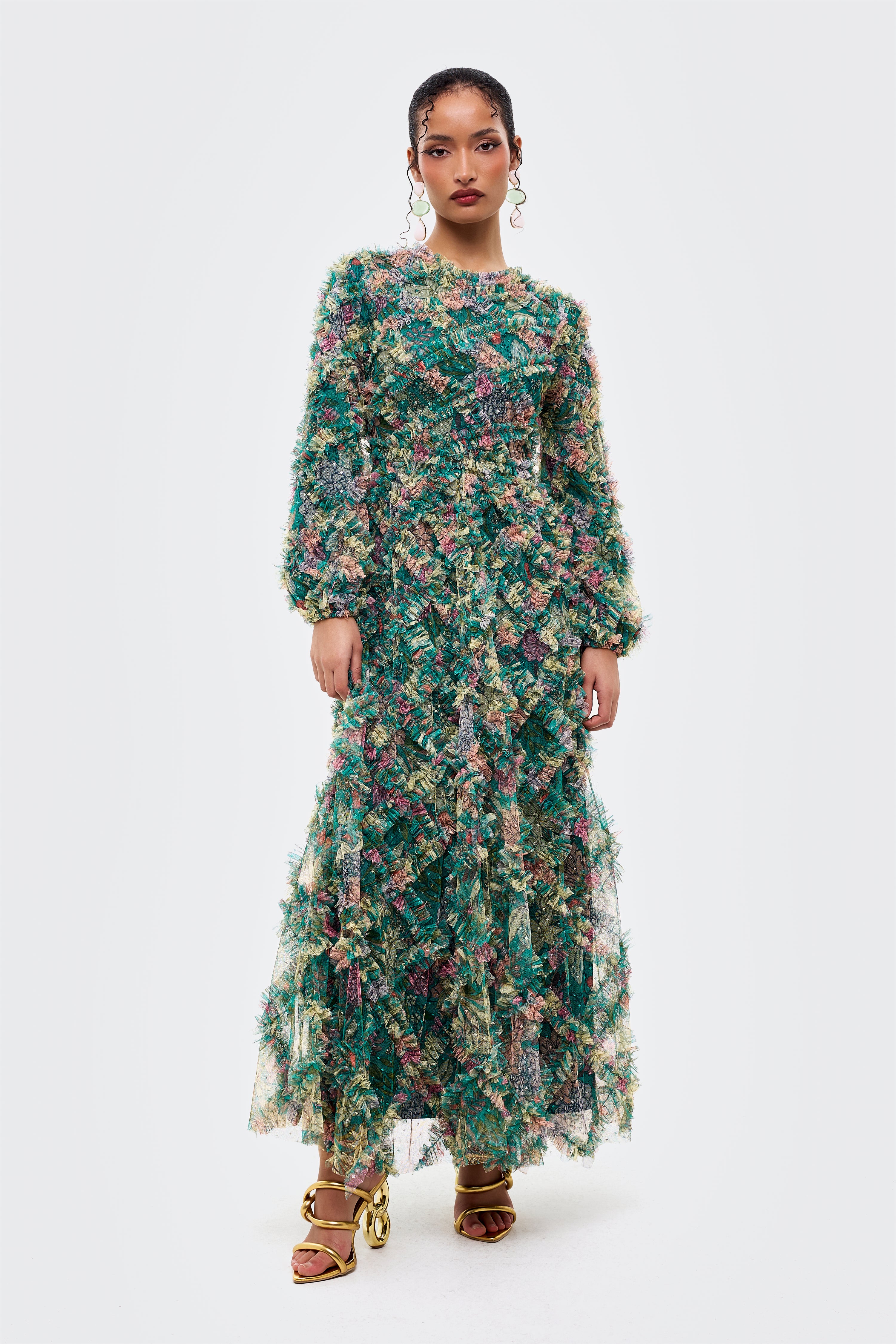 Woman wearing a floral dress on a white background