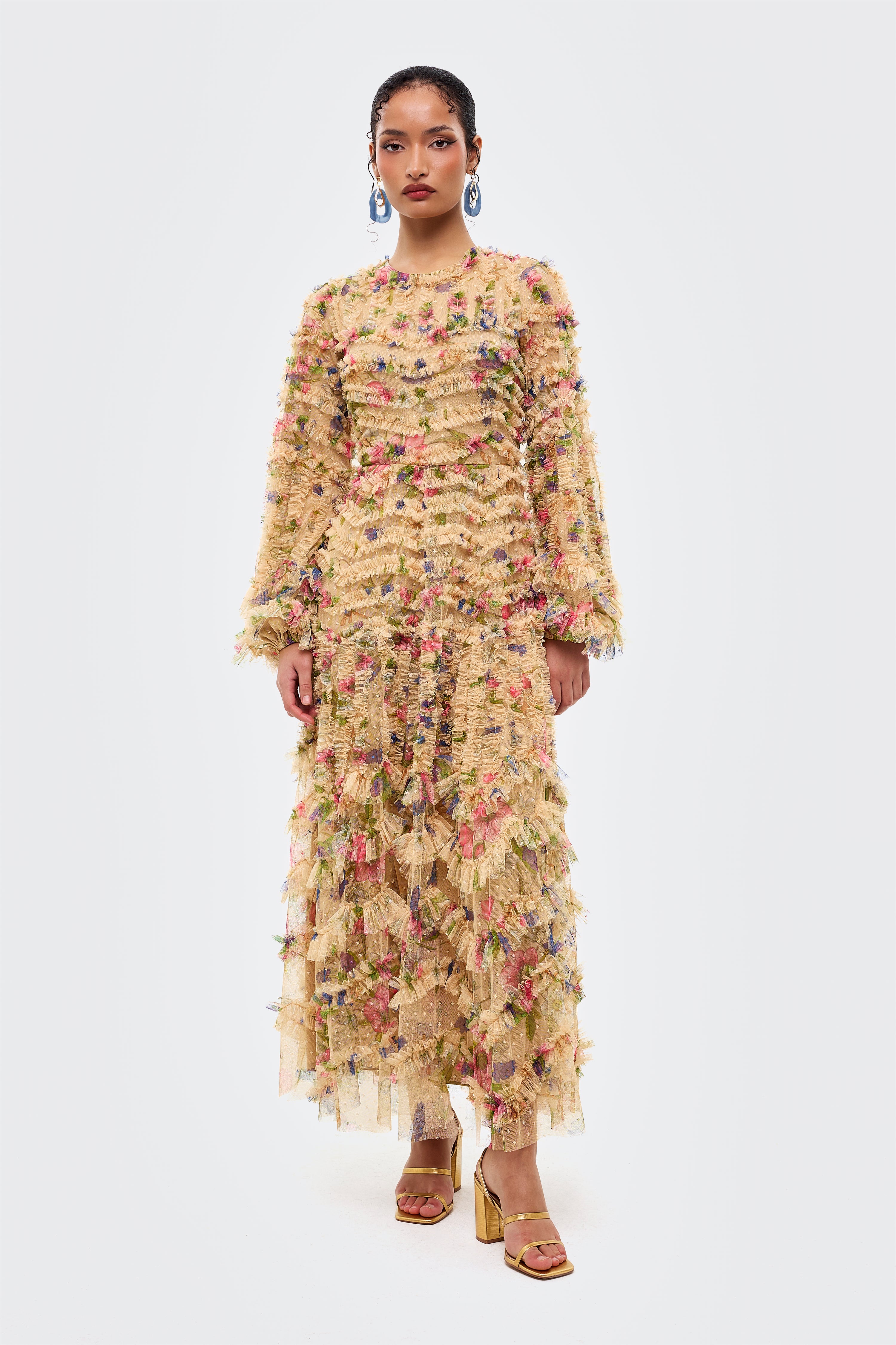 Woman wearing a floral dress on a white background